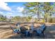 Stone fire pit surrounded by Adirondack chairs at 2529 Piney Grove Rd, Loganville, GA 30052