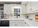 Bright kitchen with white cabinets, subway tile backsplash, and stainless steel appliances at 2529 Piney Grove Rd, Loganville, GA 30052