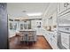 Updated kitchen featuring white Shaker cabinets and a granite-topped island at 2529 Piney Grove Rd, Loganville, GA 30052