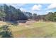 Open lot with distant home and shed at 2529 Piney Grove Rd, Loganville, GA 30052