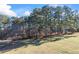 Wooded lot with distant home and trees at 2529 Piney Grove Rd, Loganville, GA 30052