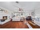 Bright living room with hardwood floors, fireplace, and barn door accent at 2529 Piney Grove Rd, Loganville, GA 30052