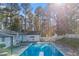 Refreshing pool, surrounded by lush trees at 2529 Piney Grove Rd, Loganville, GA 30052