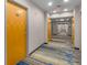 Long hallway with wood floors and doors at 3324 Peachtree Ne Rd # 1510, Atlanta, GA 30326