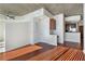 Spacious living room with hardwood floors and exposed concrete accents at 3324 Peachtree Ne Rd # 1510, Atlanta, GA 30326