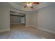 Bright and airy basement bedroom with carpeted floors at 3374 Islesworth Trce, Duluth, GA 30097