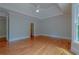 Bright bedroom with hardwood floors and large window at 3374 Islesworth Trce, Duluth, GA 30097