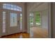 Elegant entryway with hardwood floors and arched doorway at 3374 Islesworth Trce, Duluth, GA 30097