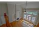 High-ceilinged living room with hardwood floors and fireplace at 3374 Islesworth Trce, Duluth, GA 30097