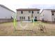 Spacious backyard featuring a house, a soccer net, and sparse grass at 3227 Hidden Valley Cir, Lawrenceville, GA 30044
