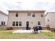 Backyard featuring a house, a patio with a grill, and a green lawn at 3227 Hidden Valley Cir, Lawrenceville, GA 30044