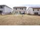 Large backyard featuring a house and a green net at 3227 Hidden Valley Cir, Lawrenceville, GA 30044