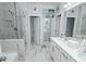 Bathroom with white double vanity and marble shower and floors at 3227 Hidden Valley Cir, Lawrenceville, GA 30044