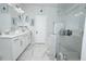 Bathroom with double vanity, shower, and tile at 3227 Hidden Valley Cir, Lawrenceville, GA 30044