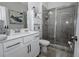 Modern bathroom features a shower, single vanity, and tiled floors at 3227 Hidden Valley Cir, Lawrenceville, GA 30044
