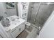Modern bathroom features a shower, single vanity, and tiled floors at 3227 Hidden Valley Cir, Lawrenceville, GA 30044
