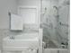 Bathroom with tub, shower, tile, and light from the window at 3227 Hidden Valley Cir, Lawrenceville, GA 30044