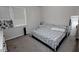 Cozy bedroom featuring carpet flooring, a comfy bed, and a full-length mirror at 3227 Hidden Valley Cir, Lawrenceville, GA 30044