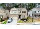 Charming two-story home featuring a brick facade, well-maintained landscaping, and an attached two-car garage at 3227 Hidden Valley Cir, Lawrenceville, GA 30044