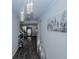 Bright hallway with modern light fixtures, hardwood floors, and stylish decor, leading to the rest of the home at 3227 Hidden Valley Cir, Lawrenceville, GA 30044