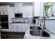 Close up of kitchen with granite counters, stainless steel appliances, and a view of the window above the sink at 3227 Hidden Valley Cir, Lawrenceville, GA 30044