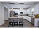 Modern kitchen featuring stainless steel appliances, granite countertops, a kitchen island, and a stylish backsplash at 3227 Hidden Valley Cir, Lawrenceville, GA 30044