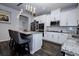 Modern kitchen featuring stainless steel appliances, granite countertops, a kitchen island, and a stylish backsplash at 3227 Hidden Valley Cir, Lawrenceville, GA 30044