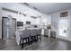 Modern kitchen featuring stainless steel appliances, granite countertops, a kitchen island, and a stylish backsplash at 3227 Hidden Valley Cir, Lawrenceville, GA 30044