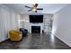 Cozy living room features a fireplace, modern furnishings, and a large flat screen television for relaxing and entertaining at 3227 Hidden Valley Cir, Lawrenceville, GA 30044