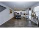 Spacious open-concept with wood floors flows into a well-appointed kitchen with a large kitchen island at 3227 Hidden Valley Cir, Lawrenceville, GA 30044