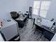 Office space with hardwood floors, large desks, and natural light from the windows at 3227 Hidden Valley Cir, Lawrenceville, GA 30044