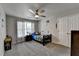 Simple bedroom with a twin bed, window, and ceiling fan at 861 Chandler Rd, Lawrenceville, GA 30045