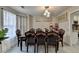 Elegant dining room with a large wood table and seating for eight at 861 Chandler Rd, Lawrenceville, GA 30045