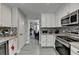 Modern kitchen with stainless steel appliances and granite countertops at 861 Chandler Rd, Lawrenceville, GA 30045