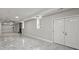 Spacious finished basement featuring a fireplace and double doors at 1320 Melbenan Dr, Atlanta, GA 30311