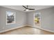 Light and airy bedroom with hardwood floors, ceiling fan, and bright windows at 1320 Melbenan Dr, Atlanta, GA 30311