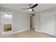 A bedroom is shown with hardwood floors, neutral walls, closet, and doorway to the bathroom at 1320 Melbenan Dr, Atlanta, GA 30311