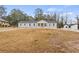 Newly renovated house with a large front yard and long driveway at 1320 Melbenan Dr, Atlanta, GA 30311