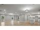 Open-concept living space with hardwood floors and a view into the kitchen at 1320 Melbenan Dr, Atlanta, GA 30311