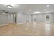 Bright living room with hardwood floors, a ceiling fan, and several doorways at 1320 Melbenan Dr, Atlanta, GA 30311