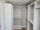 Spacious walk-in closet featuring custom shelving and ample storage at 1320 Melbenan Dr, Atlanta, GA 30311