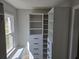 Well-organized walk-in closet featuring custom shelving and drawer systems, maximizing storage and accessibility at 1320 Melbenan Dr, Atlanta, GA 30311