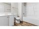 Bathroom featuring a toilet, shower, and vanity with wood floors at 2916 Ward Lake Way, Ellenwood, GA 30294