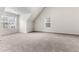 Large bedroom featuring neutral walls, carpet flooring, and two windows at 2916 Ward Lake Way, Ellenwood, GA 30294
