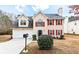 Charming two-story home with attached two-car garage and well-maintained front yard at 2916 Ward Lake Way, Ellenwood, GA 30294