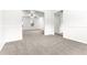 Bright living room with neutral carpet and open view to another room at 2916 Ward Lake Way, Ellenwood, GA 30294