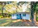 White brick ranch house with gray shutters, steps, and landscaping at 3182 Latona Sw Dr, Atlanta, GA 30354