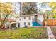 Back of house with teal stairs and storage shed at 3182 Latona Sw Dr, Atlanta, GA 30354