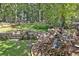 Serene backyard with stone waterfall and lush landscaping at 314 Sandalin Ln, Peachtree City, GA 30269