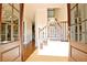 Bright entryway with hardwood floors and elegant staircase at 314 Sandalin Ln, Peachtree City, GA 30269